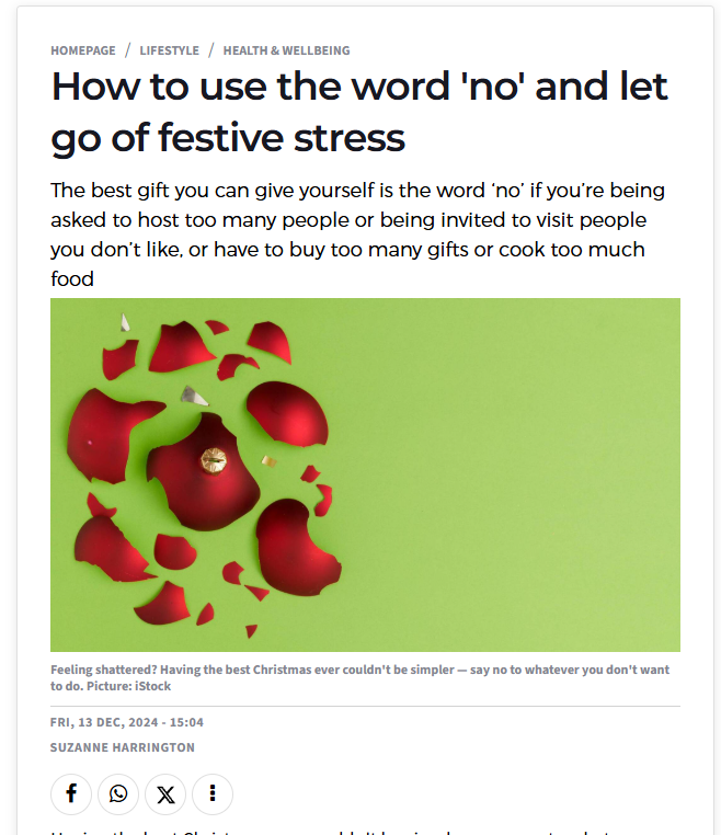 Broken Christmas bauble on green background symbolising holiday stress and the importance of saying no for self-care.